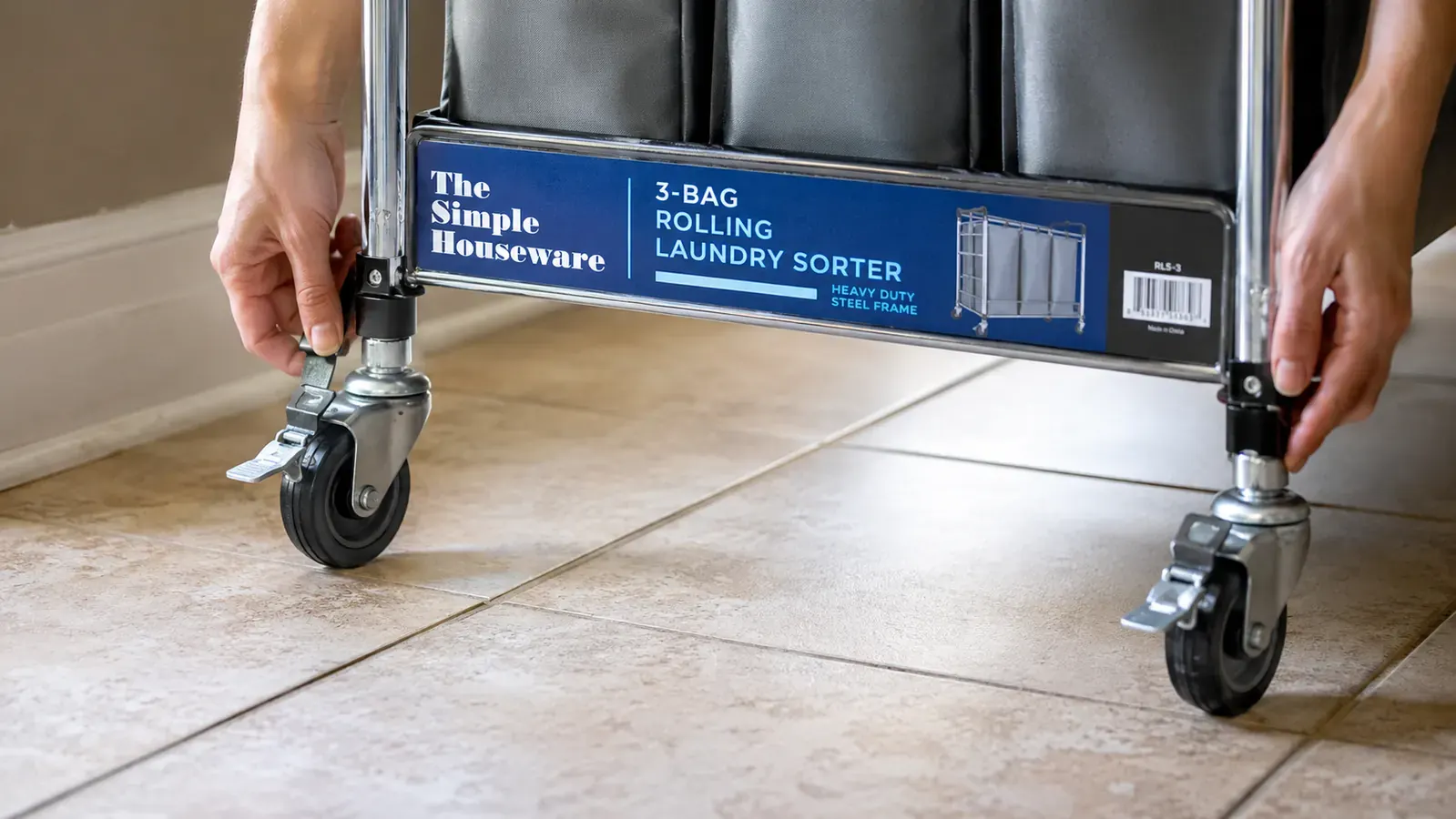 Bottom view of the laundry sorter cart showing the four locking wheels on a tile floor